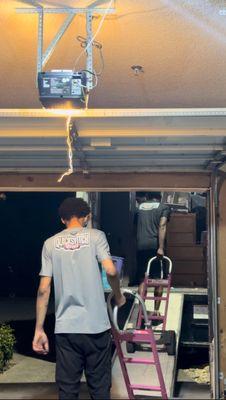 Movers unloading a Penske truck.