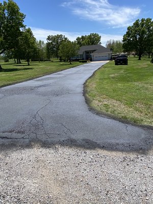 Freshly sealed asphalt drive