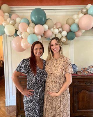 My beautiful pregnant Sister and myself in front of the arch.