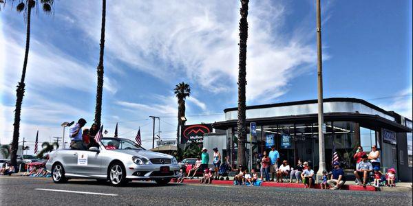 Oceanside City Council-member Ryan Keim riding well during the Independence Day Parade in our Mullen Auto Sales Mercedes Benz CLK.