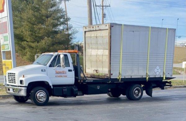 Specialized hauling and storage building moving