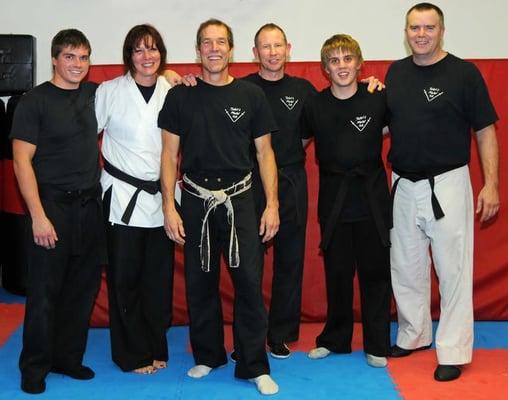 Sensei Roger Salick (third from left) with some of his black belt students.