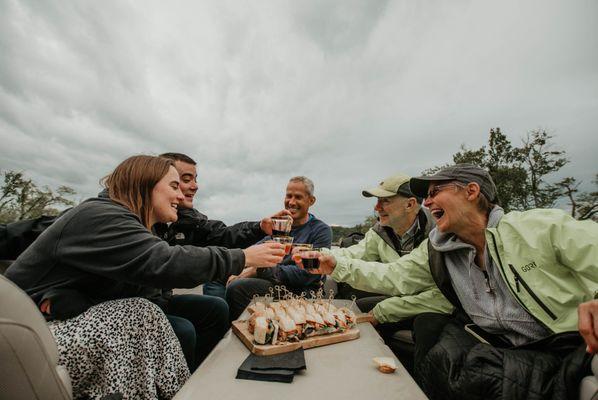 Tour group toasting to a great trip with Hudson Valley Detours while on their river cruise.