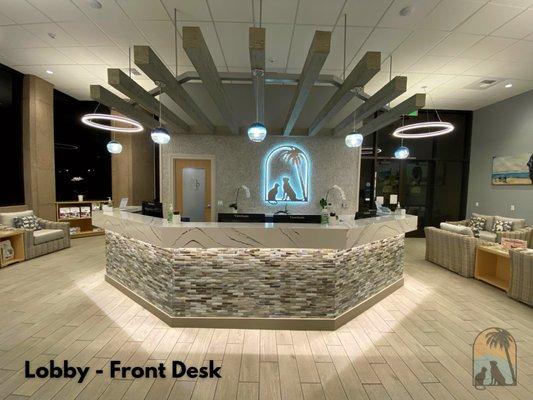 Pictured: the front desk from a client's point-of-view, facing both dog & cat entrances. Highlighted LCAH metal logo sign featured.