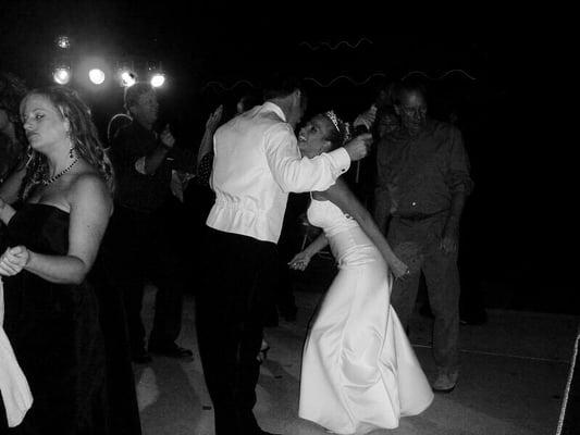 The happy Bride and Groom Jamming to the tunes on their special day.