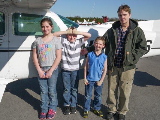 Dad with kids after their first airplane ride!