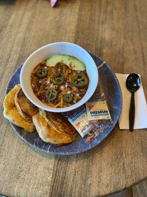 Chili w/cheddar, red onions, jalapeños, avocado and grilled cheese