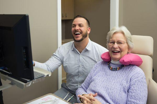 Dr. Peluso smiling with his patient.