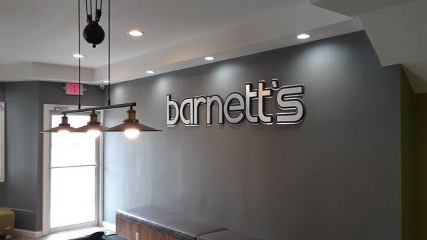 Dimensional lettering on interior wall of barbershop.