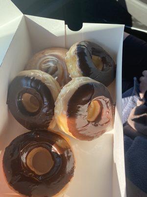 Chocolate covered donuts and a cinnamon roll