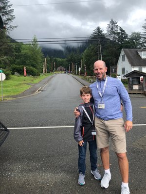 My fam standing on the side of a busy road w/ totems off in the distance. I wish I had more pictures but there was nothing else to see