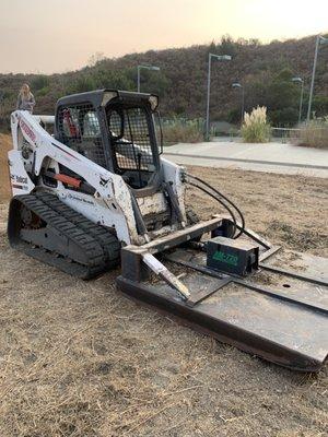 Bobcat T650 and an Ambusher mower