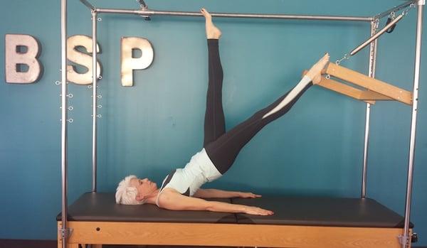 Melissa using the Cadillac at Balanced Spirit Pilates in Tucson, AZ.