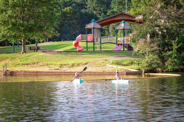 The park offers a swim area, multiple playgrounds, and paddling rentals.