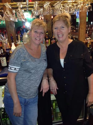 Two Hot Chics serving beer and burgers.