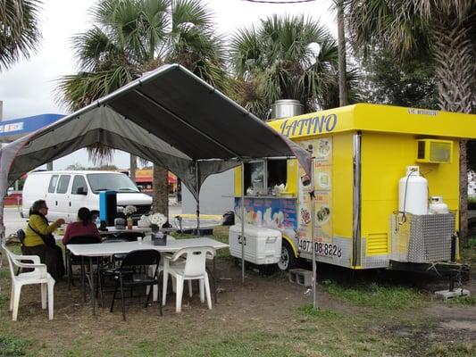 Little Yellow Latina food truck is tucked behind the gas station.