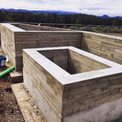 Board formed fire pit and planter box/bench backrest/decorative wall in Bend Oregon