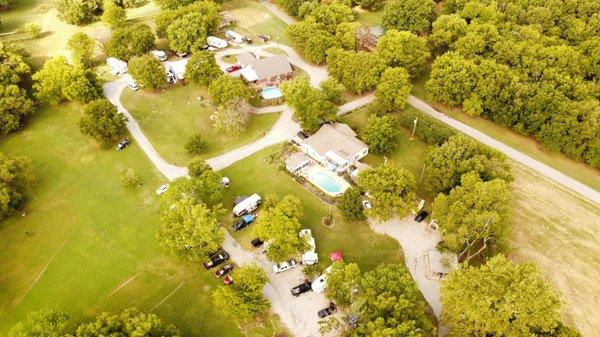 Drone view of our campground. Cabins, large vacation homes, RV park and lots of shady tent sites.