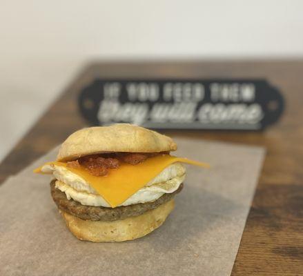 Soul Good biscuit sandwich- Eggs, cheddar cheese, choice of meat & locally made apple sage jam.