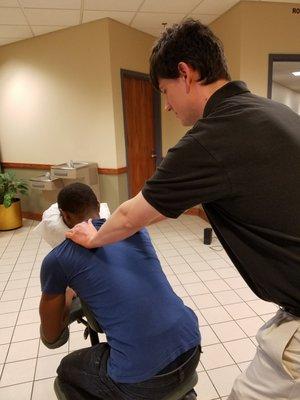 Ian Thomas gives chair massages at a local college to relieve stress during mid-terms and finals.