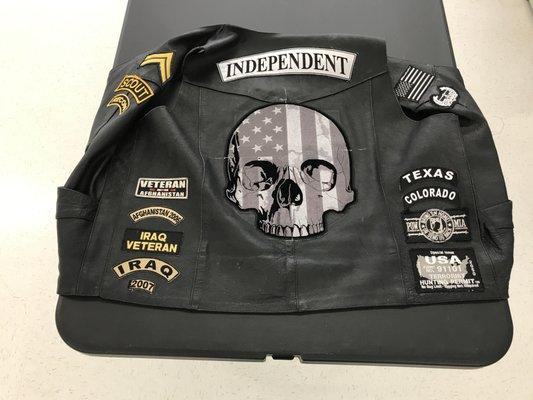 Memorable Patches Sewn to Leather Vest