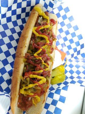 Footlong with cheese sauce,chili beans,grilled onions Jalapeños and bacon.