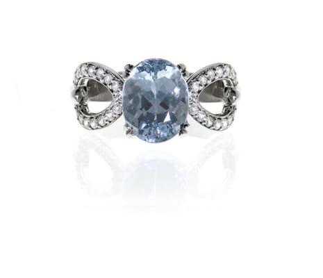 Aquamarine ring with brilliant cut diamonds set in 14kt gold.