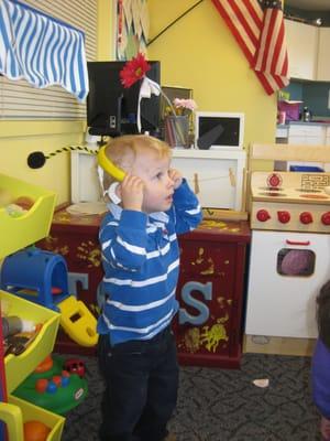 An Early Intervention student learning about the "Hungry Caterpillar."