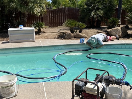 You can see how bad my pool tiles were with calcium buildup from our hard water.