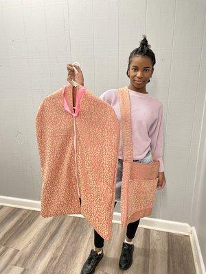 Our talented student showing her garment bag and tote bag she made to use during her travels.