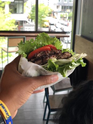 Whole30 compliant burger. Tomato, hamburger, lettuce.