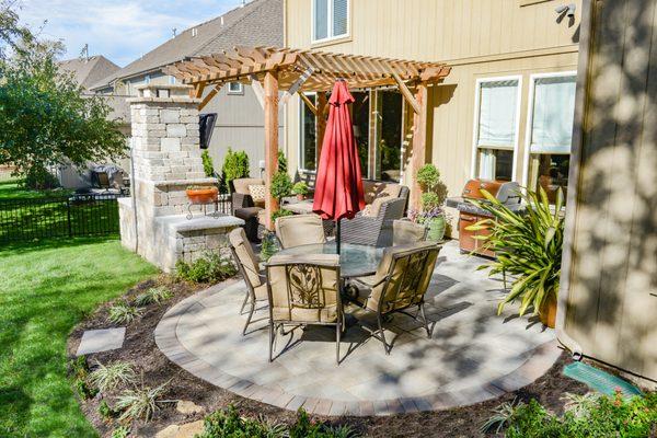 Check out this amazing project in Olathe, KS! It has the following features: paver patio, seating wall, fireplace, and pergola! If you'd lik