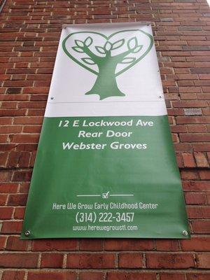 Banner outside of Here We Grow ECC