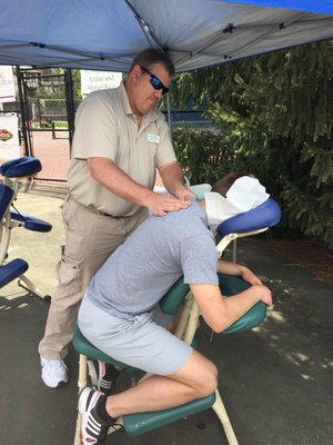 Chair massage at a tennis tournament.