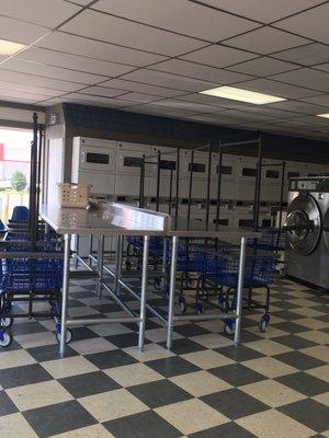 Lots of clean folding tables and a herd of carts to the customers.