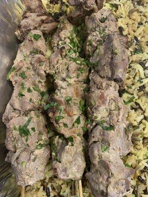 Lamb kebabs over risotto