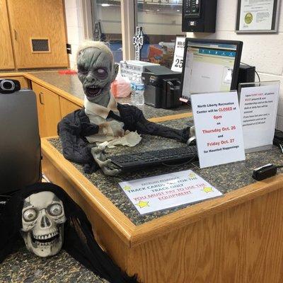 The check-in staff look a bit worn out during the Halloween season