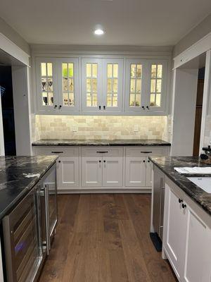 Beautiful butlers pantry with cabinets to spare!