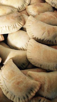 Meatpie.  Home make dough filled with beef and vegetables. Also comes in vegetarian option.