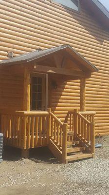 Cedar mountain cabin porch landing with roof