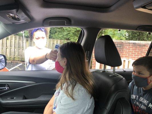 Temp checks right outside before their drive thru Flu Shot Clinic on Saturday mornings.