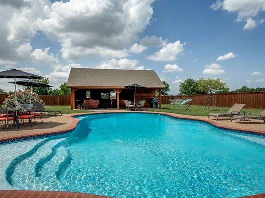 Large back yard with pool and cabana