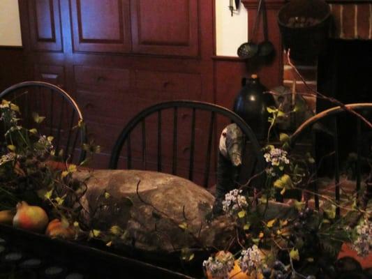 Antique goose decoy on wooden trencher makes a great table center piece