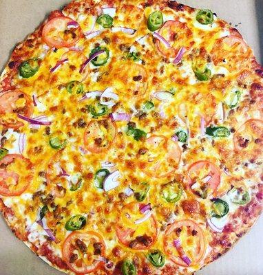 Our taco pizza on thin crust has refried beans, seasoned ground beef, tomatoes, onions, & jalapeños.