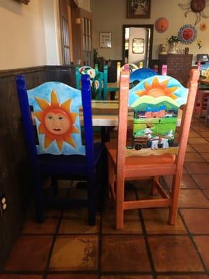 Dining Room Chairs - They have different colorful art designs.