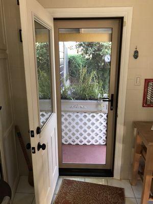 Inside looking out, CRL tan security screen door in Long Beach, Ca