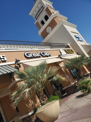 A few storefronts including the shopping center name above