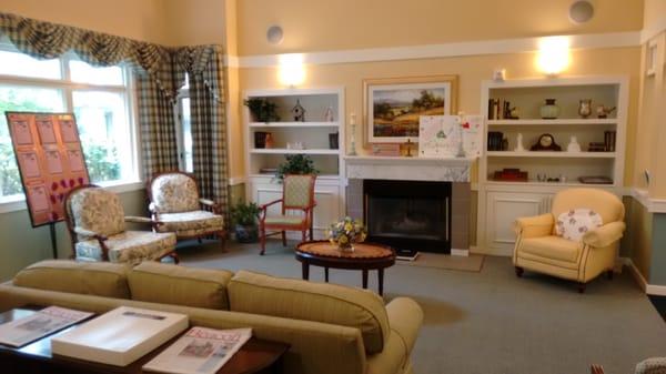 Living room looks out to neighborhood.