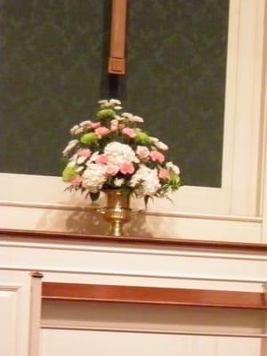 Wedding altar flowers by Holmes Shusas: roses, hydrangia, carnation, spider mums