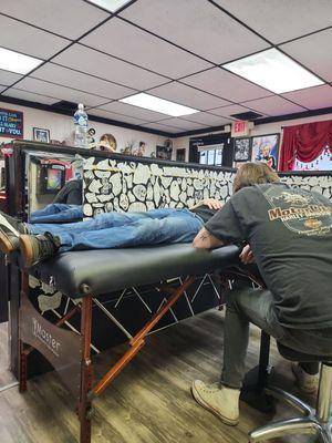 My husband getting his tattoo done by Daniel Hancock.